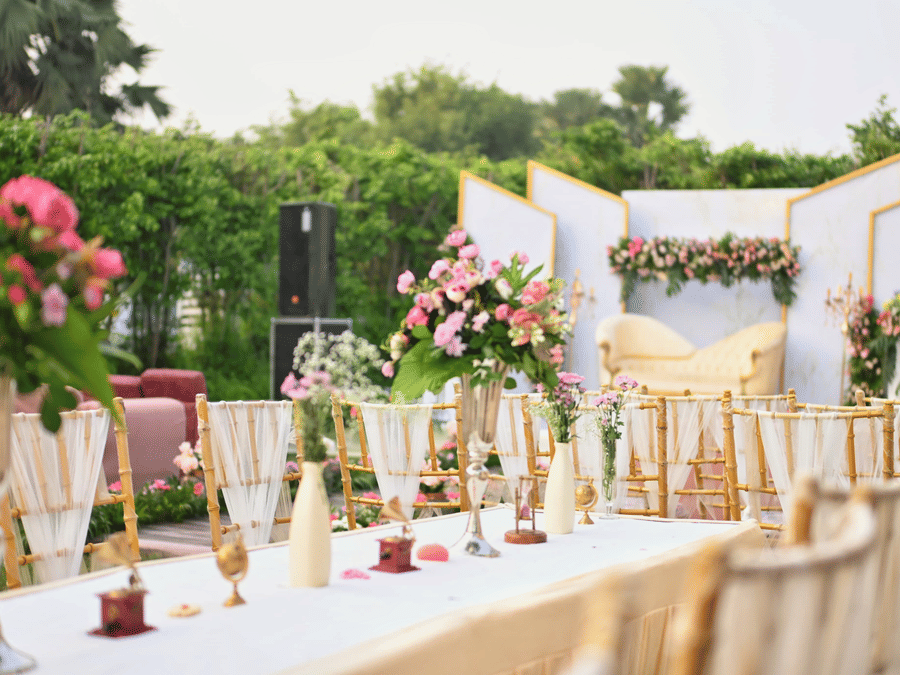 Banquet table arrangement at Marasa Sarovar Premiere, Bodhgaya with floral centrepieces, glassware and table linens