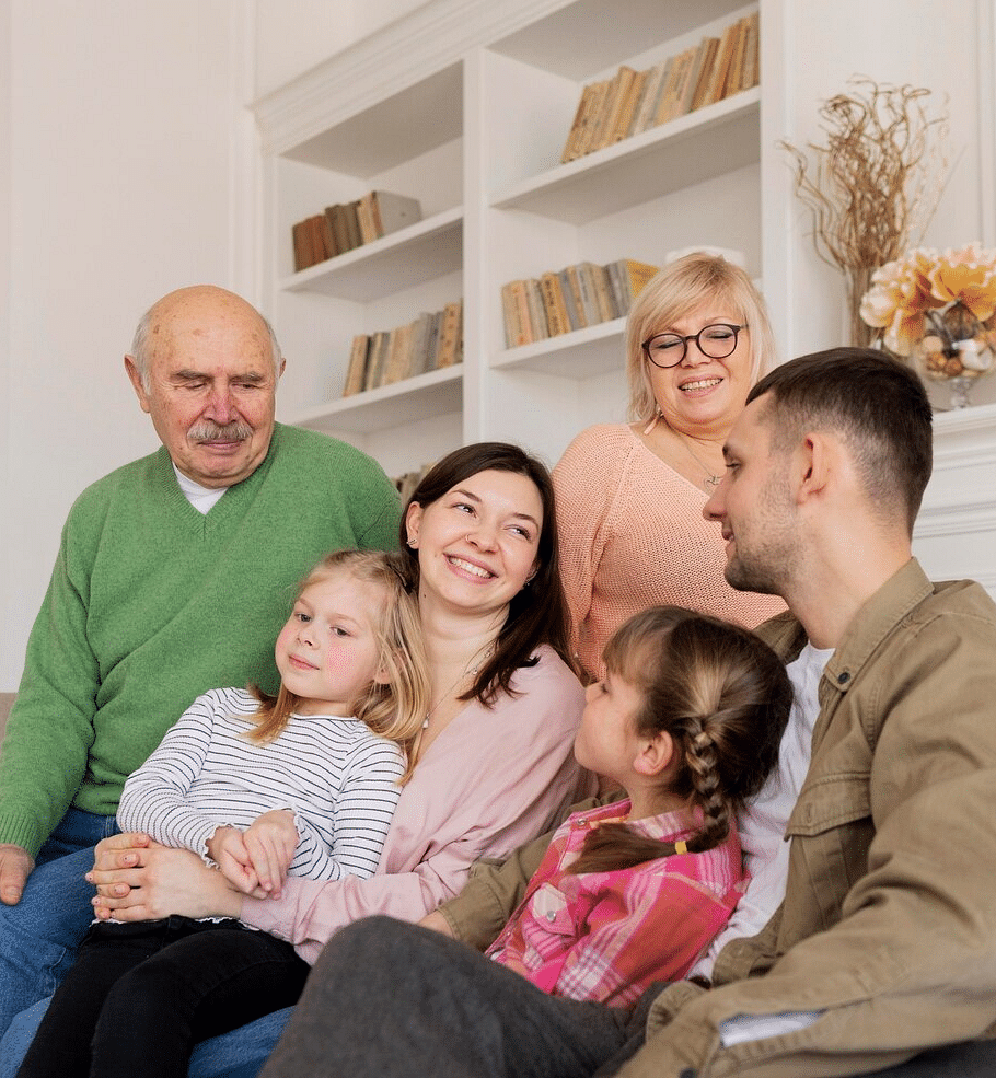 A group of people smiling at each other.