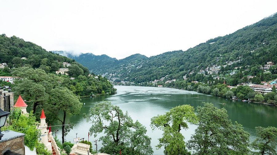 River view with lush greenery from hotel balcony at Himalaya Hotel, Nainital