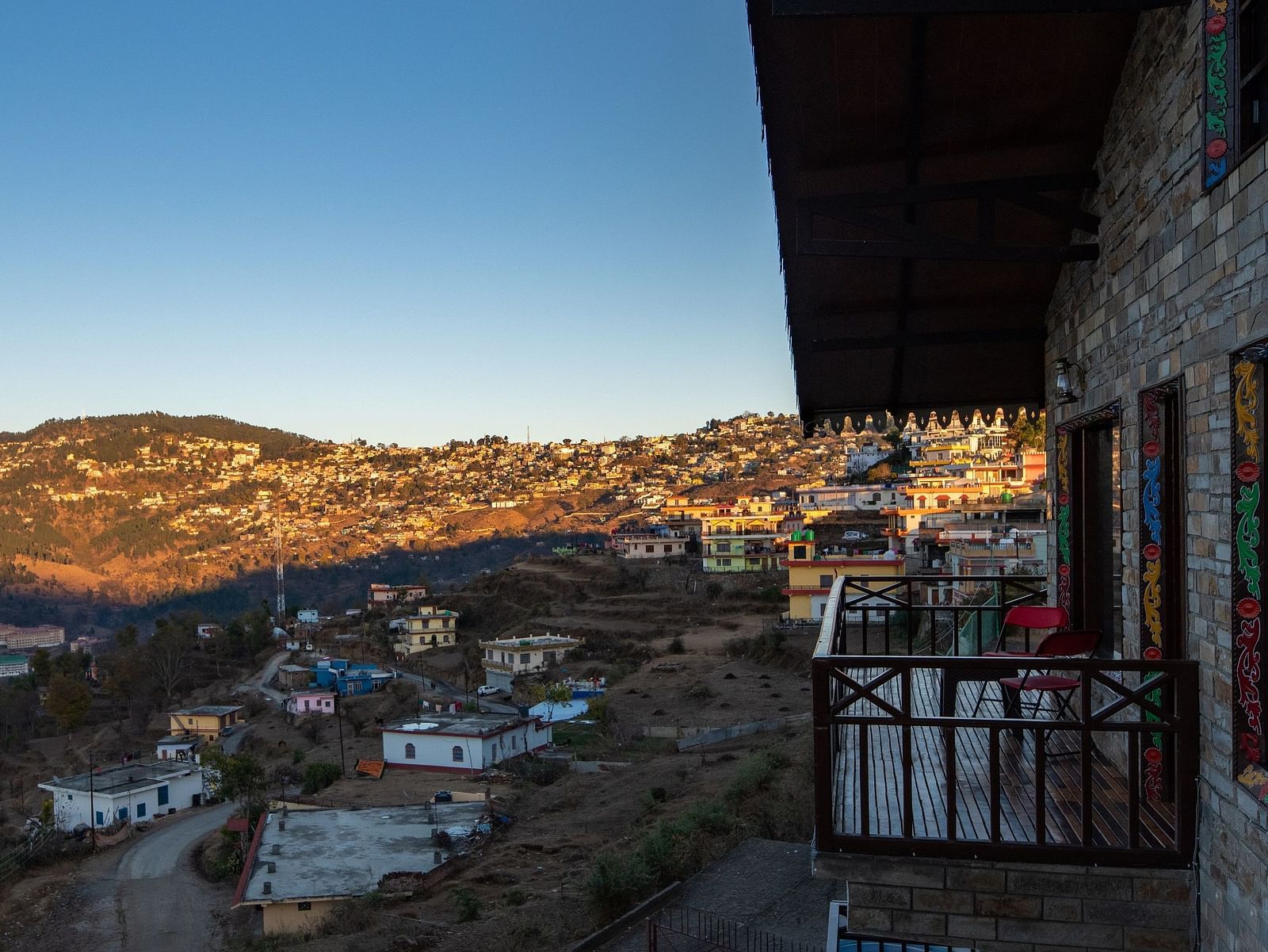 A charming homestay surrounded by lush greenery and set against the backdrop of rolling hills and blue skies. - Blusalzz Homes The Himalayan Bungalow, Almora