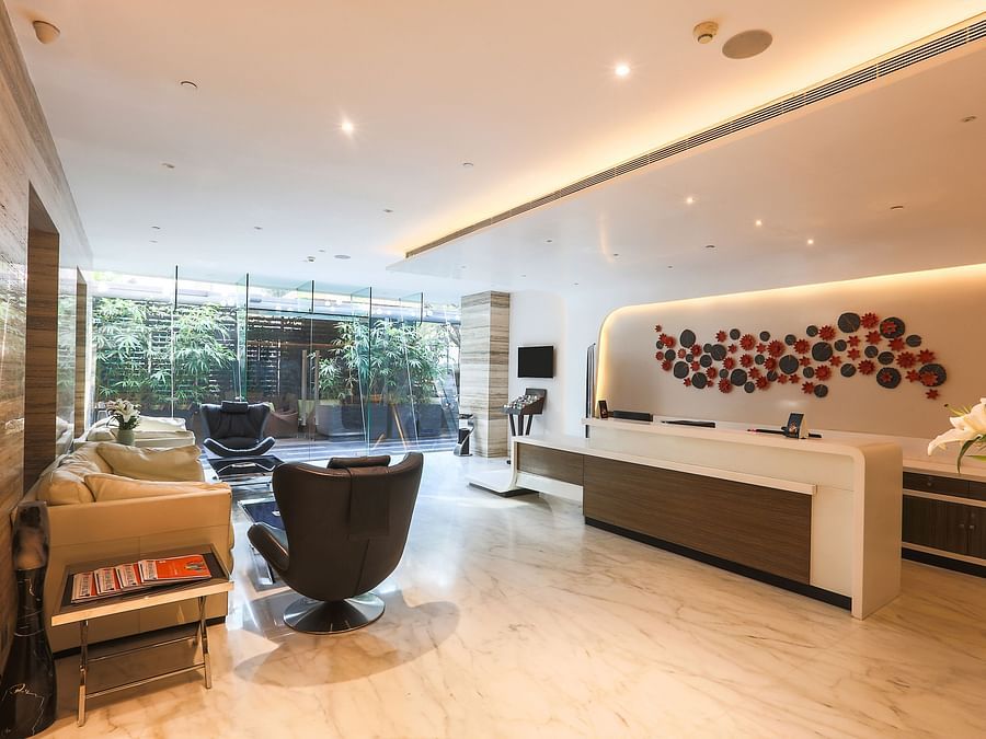 A picture of  lounge at Empresa hotel, featuring seating arrangements.