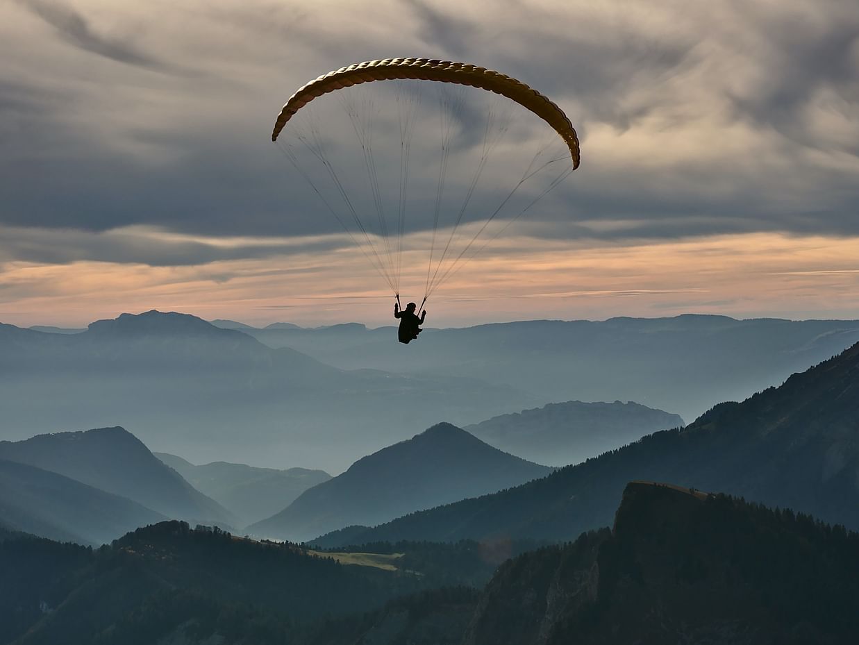 person doing paragliding