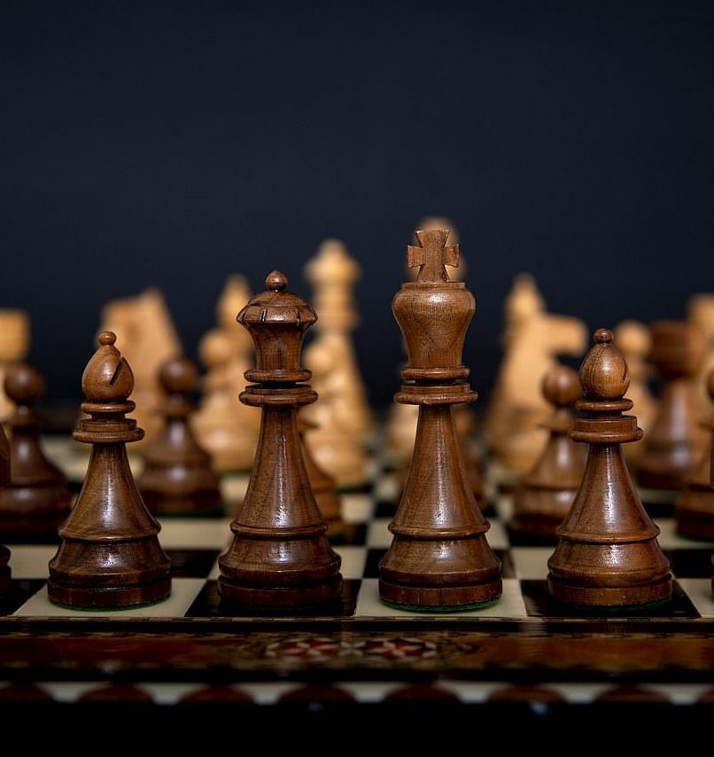 An image of a chess pieces placed on a chess board