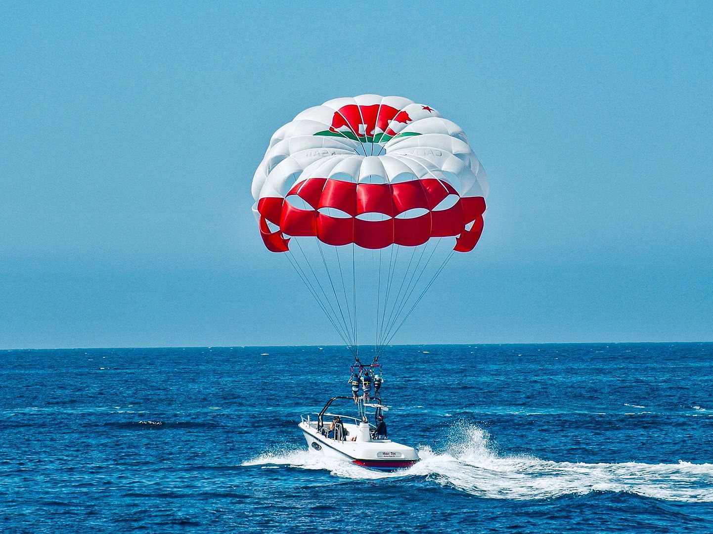 A person enjoying paragliding through a sea