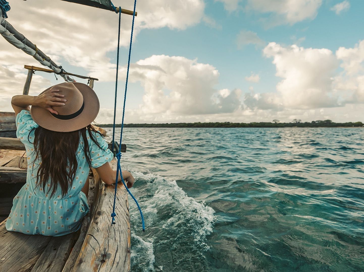 An image of a person enjoying a boat ride during a sunny day
