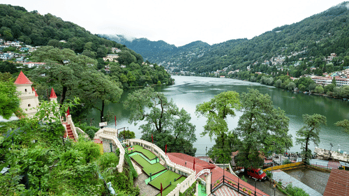 River view with lush greenery from hotel balcony at Himalaya Hotel, Nainital