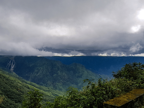 Dark rain clouds overlook the hills