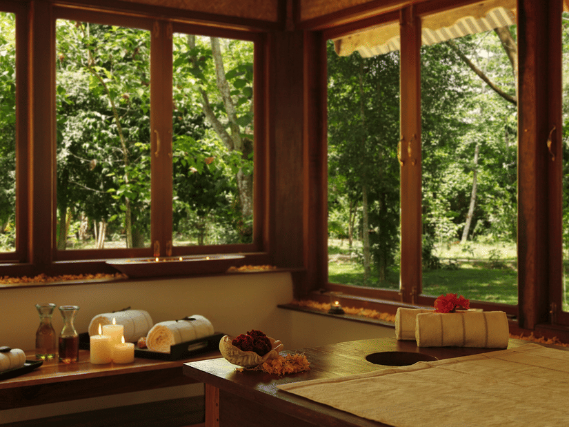 An overview of the interior of Oma Spa with a massage table and other things kept on the table at Barefoot at Havelock.