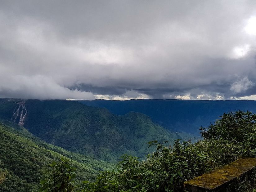 Dark rain clouds overlook the hills