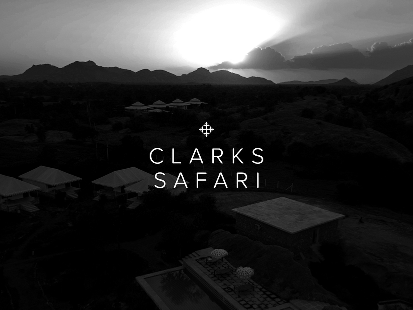 Aerial view of Clarks safari, Jawai with the text saying Clarks Safari