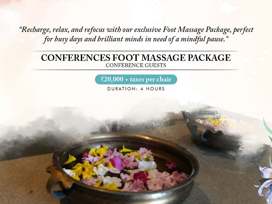 A luxurious foot massage package at a Bengaluru spa, featuring aromatic flowers in a basin, promising relaxation and rejuvenation for tired feet.