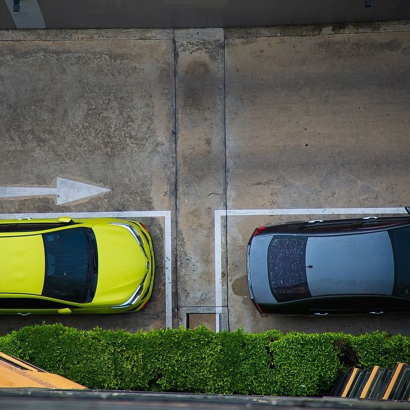 Two cars parked in the parking lot.