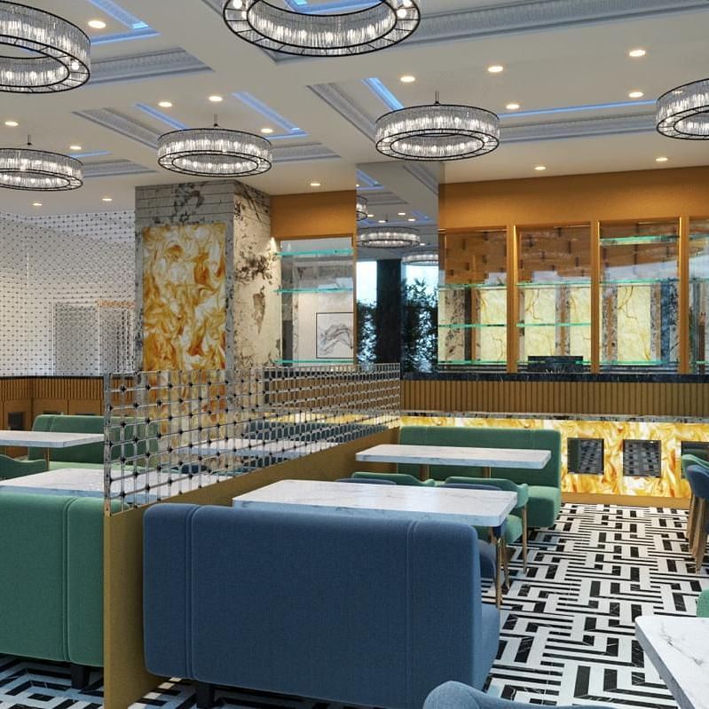 Side view of a restaurant interior featuring cushioned chairs at Hotel Mumbai House, Vashi.