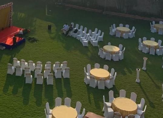 Artistic wedding layout with table arrangements and stage mock-up at Ilara Hotels & Spa, OMR, Chennai