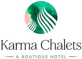 A logo that reads Karma Chalets a boutique hotel with a green wave icon, set against a light background.