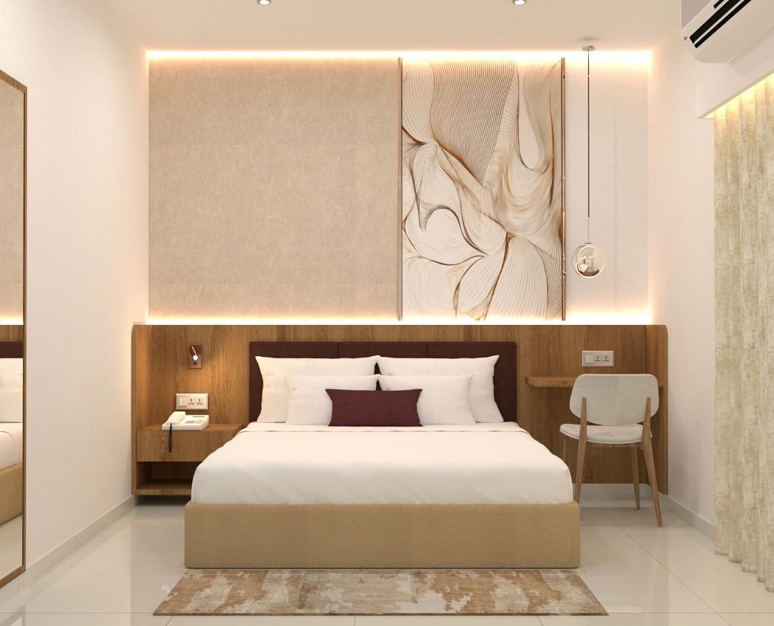 A double bed with side tables and lamps inside one of the rooms - TGI Livancia The Sojourn, Bangalore
