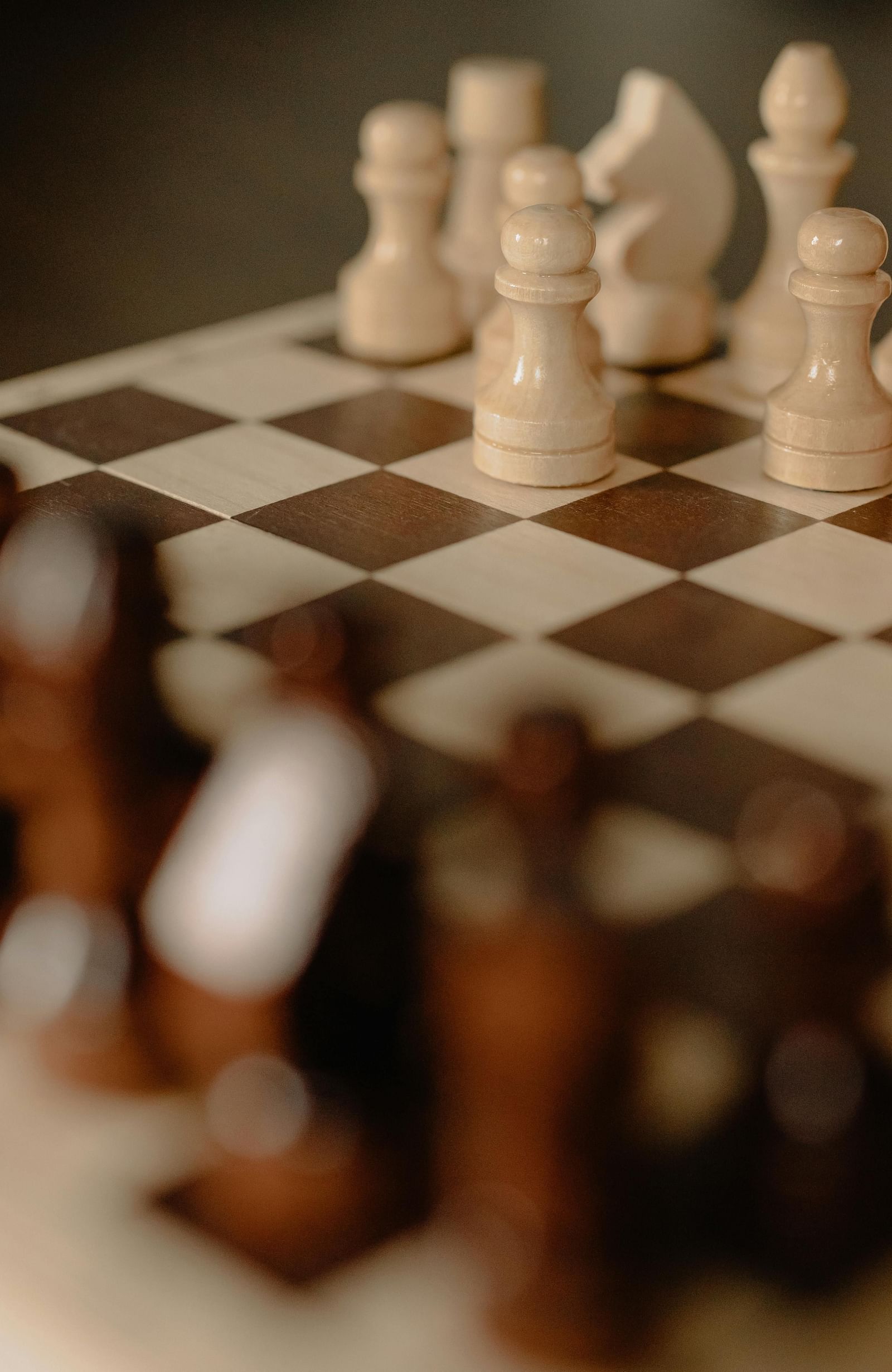 Chess pieces placed on a chess board.