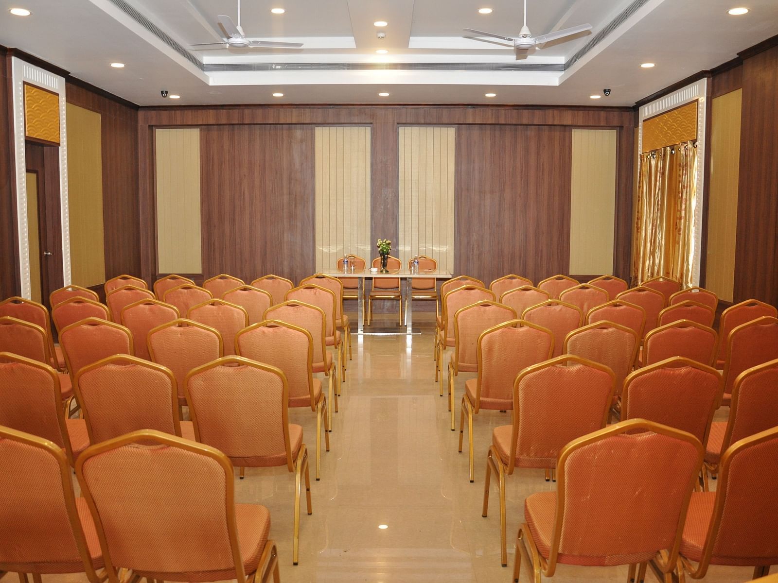 event halls with red chairs at Hotel Alps Residency, Krishnagiri
