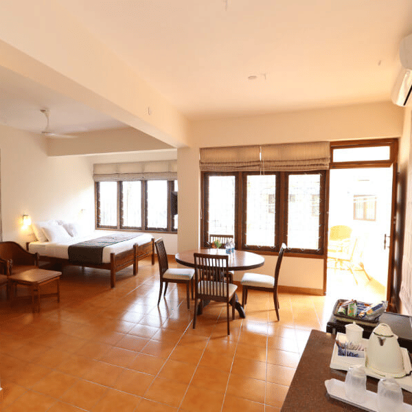 A spacious interior with seating, large windows, and open floor space.