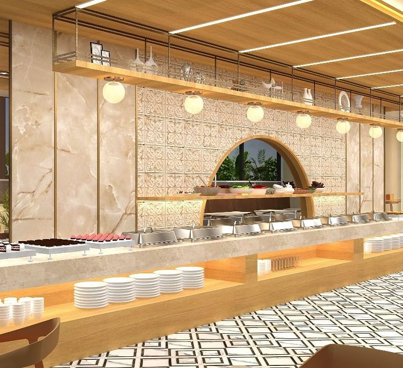 The buffet area in view with cutlery and lights above it - TGI Livancia The Sojourn, Bangalore