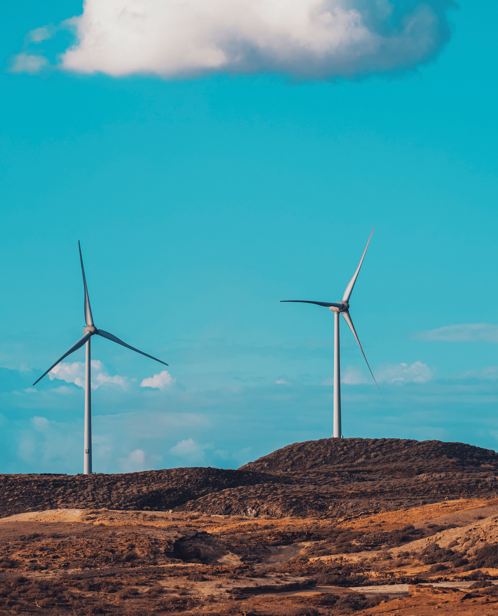 wind-turbines-in-the-country-side-against-a-blue-s-2026-03-20-00-10-19-utc