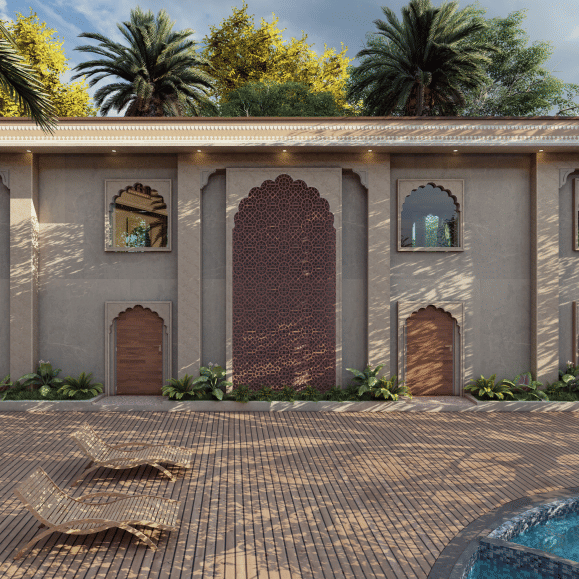 A single storey structure with multiple arched openings and a large central doorway, set along a paved courtyard with palm trees and scattered seating elements, shown as an architectural visualisation at Ananta Elite Bharatpur.