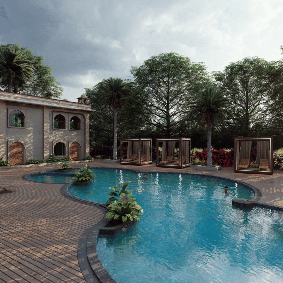 A curved swimming pool with a tiled deck, surrounded by low rise buildings, palm trees and dense greenery, with seating areas visible along the edge, shown as an architectural visualisation at Ananta Elite Bharatpur.