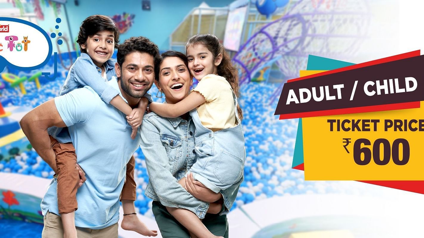     A promotional banner displaying a special adult and child ticket price of ?600, featuring a happy group enjoying water park rides and attractions.