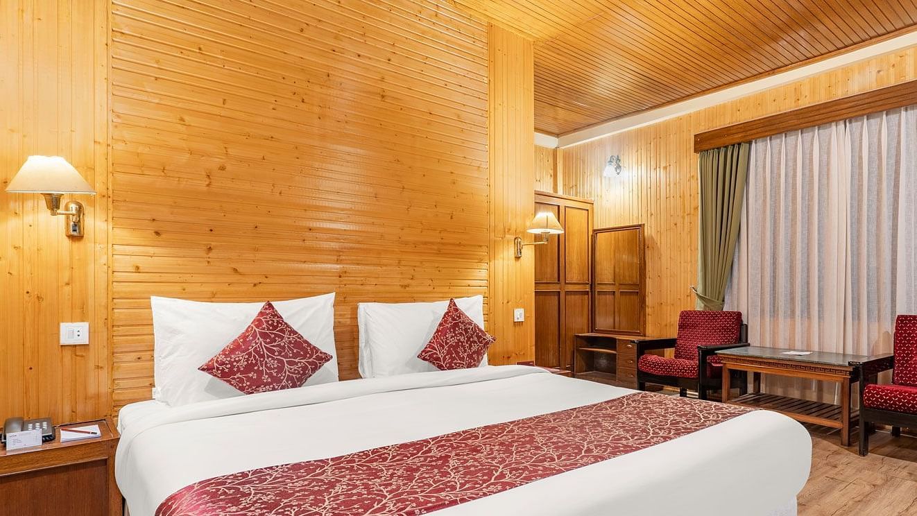 Image of a room with bed and sitting area at at Summit Tashi Ghang Heritage Resort, Pelling