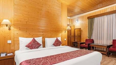 Image of a room with bed and sitting area at at Summit Tashi Ghang Heritage Resort, Pelling