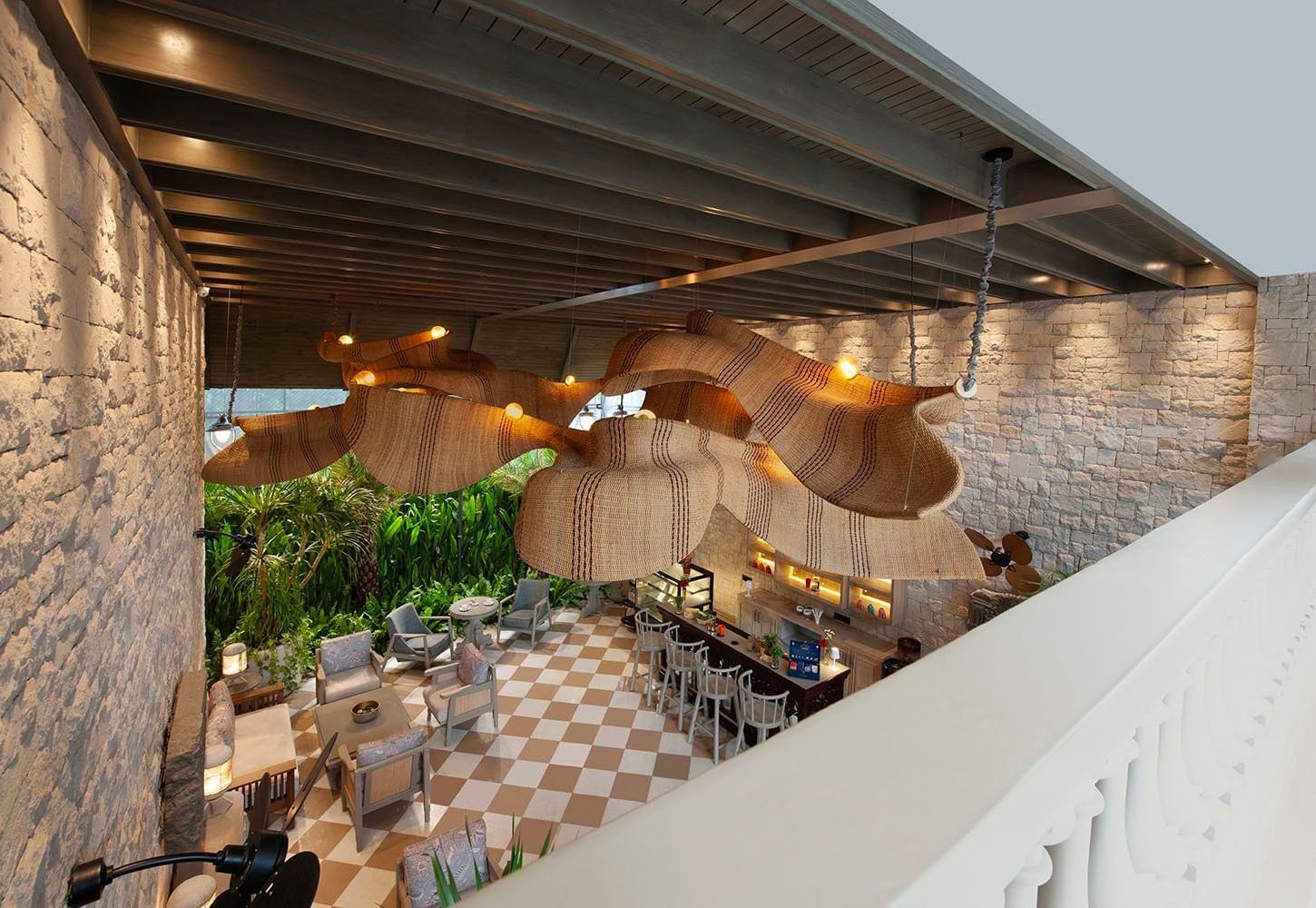 Full view of Suenos de Cafe taken from a higher level featuring an expansive dining area with ample of natural light falling over it.