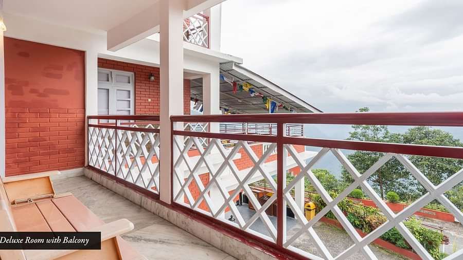Image of a balcony with a bench at Summit Tashi Ghang Heritage Resort, Pelling