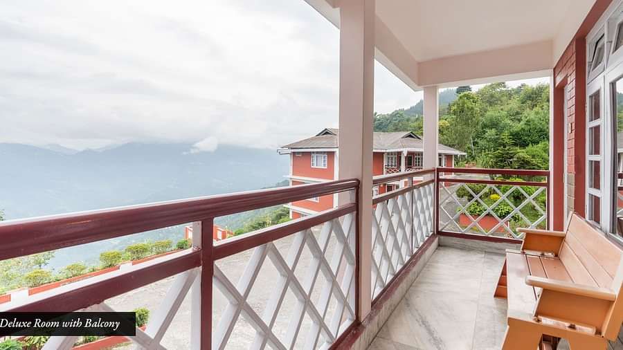 Image of a balcony with bench and view of the mountians at at Summit Tashi Ghang Heritage Resort, Pelling