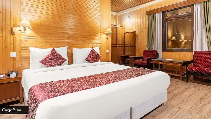 Image of a room with bed and sitting area at Summit Tashi Ghang Heritage Resort, Pelling