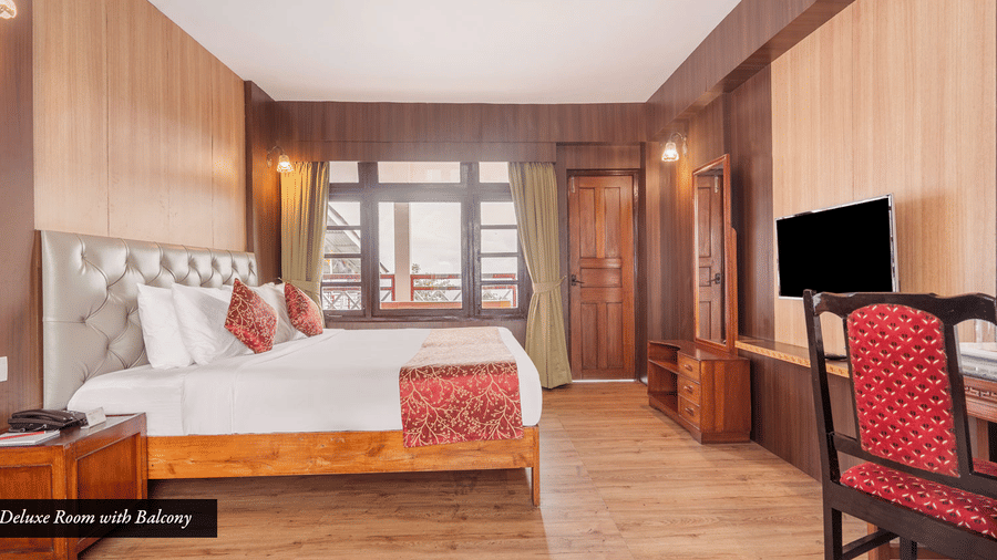Image of a room with bed and study area at Summit Tashi Ghang Heritage Resort, Pelling