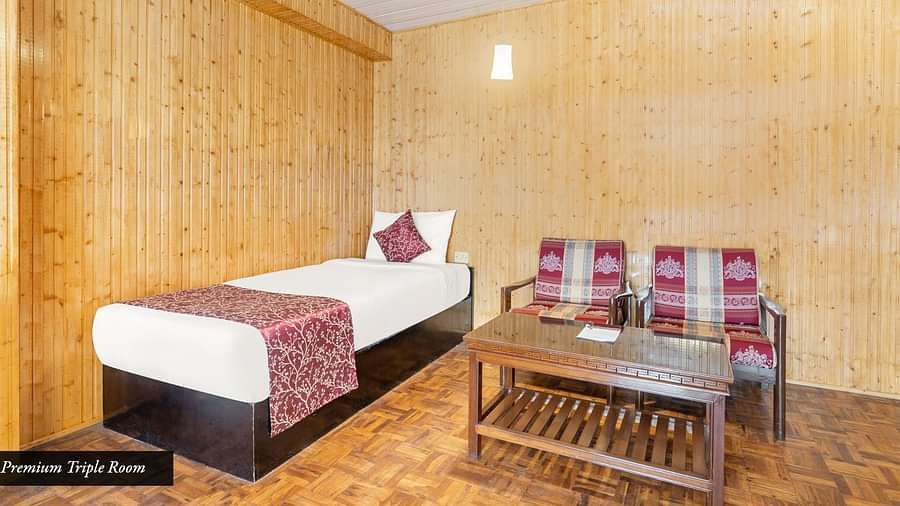 Image of a room with single bed and sitting area at Summit Tashi Ghang Heritage Resort, Pelling