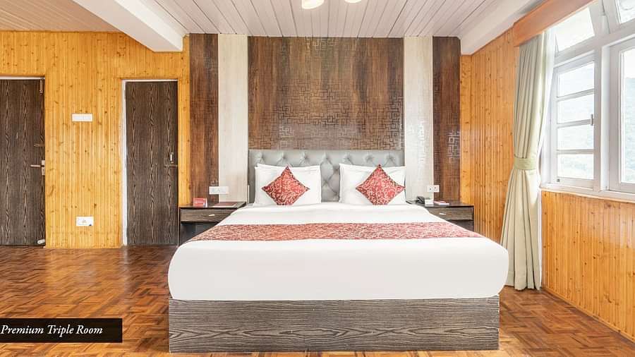 Image of premium room with a double bed and with wooden decor at Summit Tashi Ghang Heritage Resort, Pelling