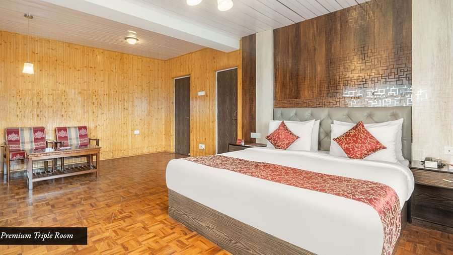 Side view of a room with bed and a sitting room at Summit Tashi Ghang Heritage Resort, Pelling