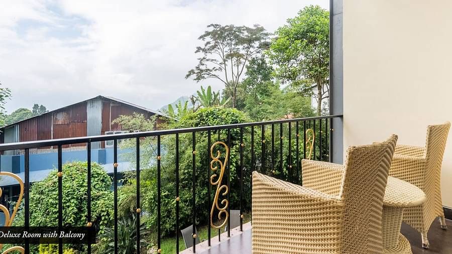 Seating arrangement in a balcony of a room at Summit Barsana Resort & Spa, Kalimpong