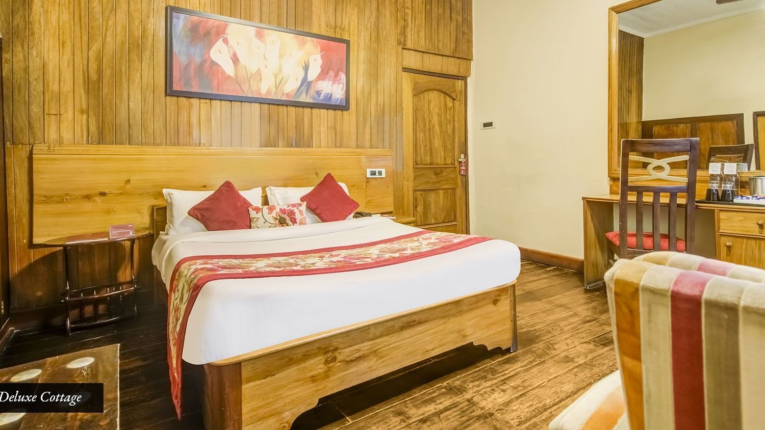 Deluxe cottage at Summit Barsana Resort & Spa, Kalimpong with a double bed