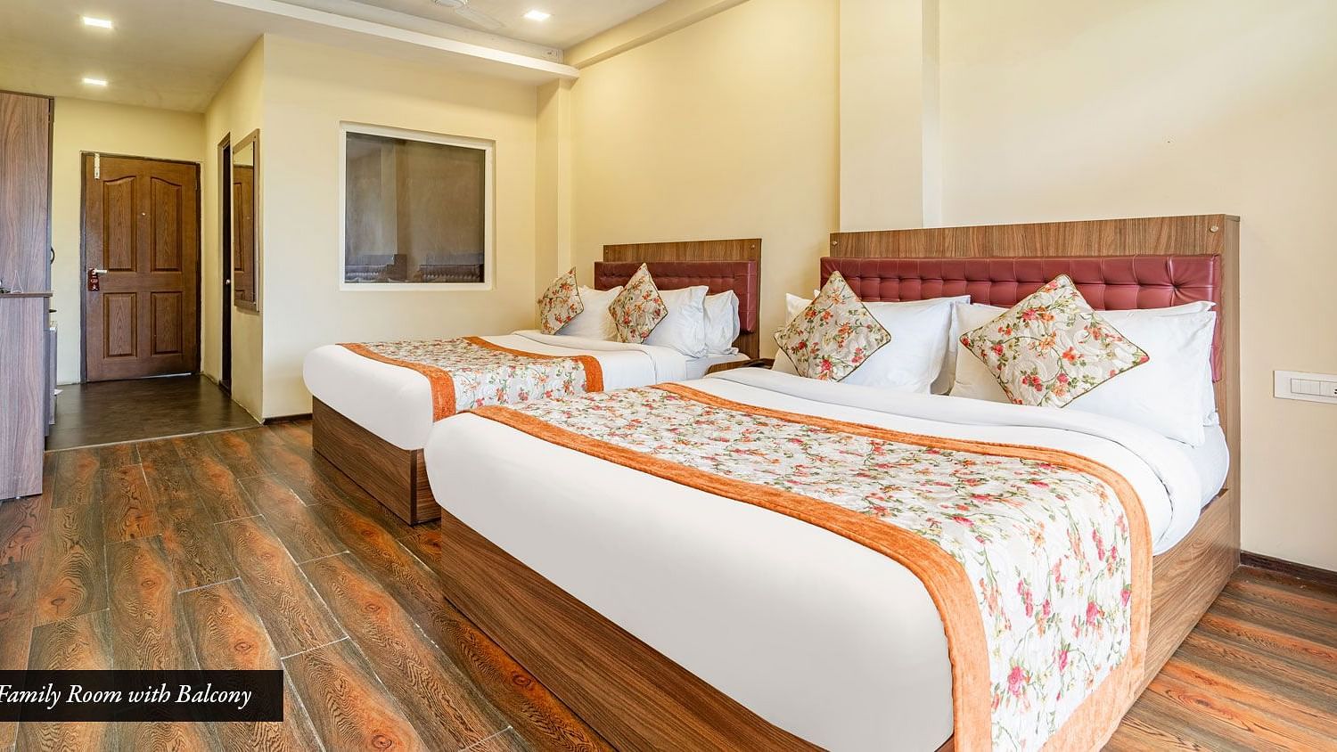 Family room at Summit Barsana Resort & Spa, Kalimpong with twin beds and a television