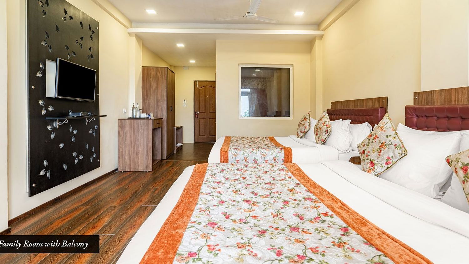 Family room at Summit Barsana Resort & Spa, Kalimpong with twin beds and a television