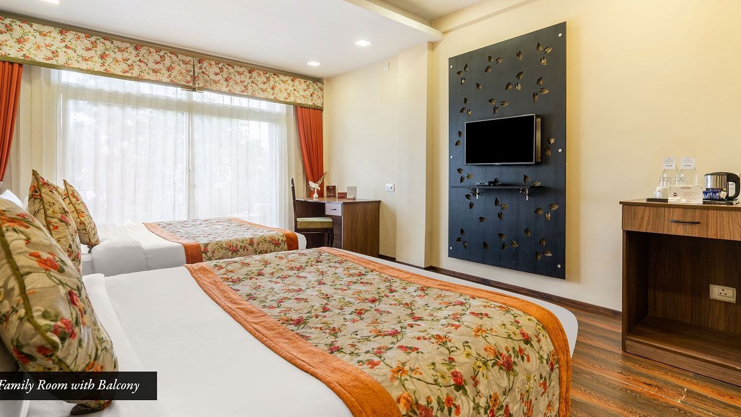 Family room at Summit Barsana Resort & Spa, Kalimpong with a double bed and a television