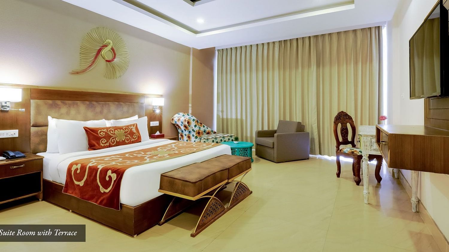 Image of a room with bed and a fancy decor piece above it at Summit By The Ganges Beach Resort & Spa, Rishikesh