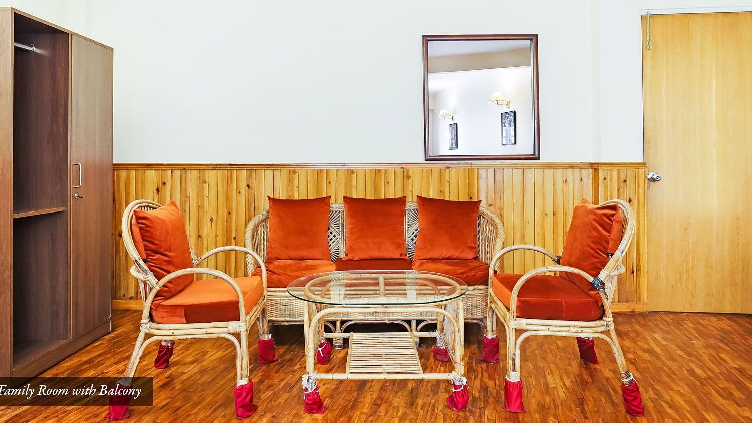 A coffee table surrounded by multiple chairs in a living area | Summit Newa Regency & Spa, Pelling