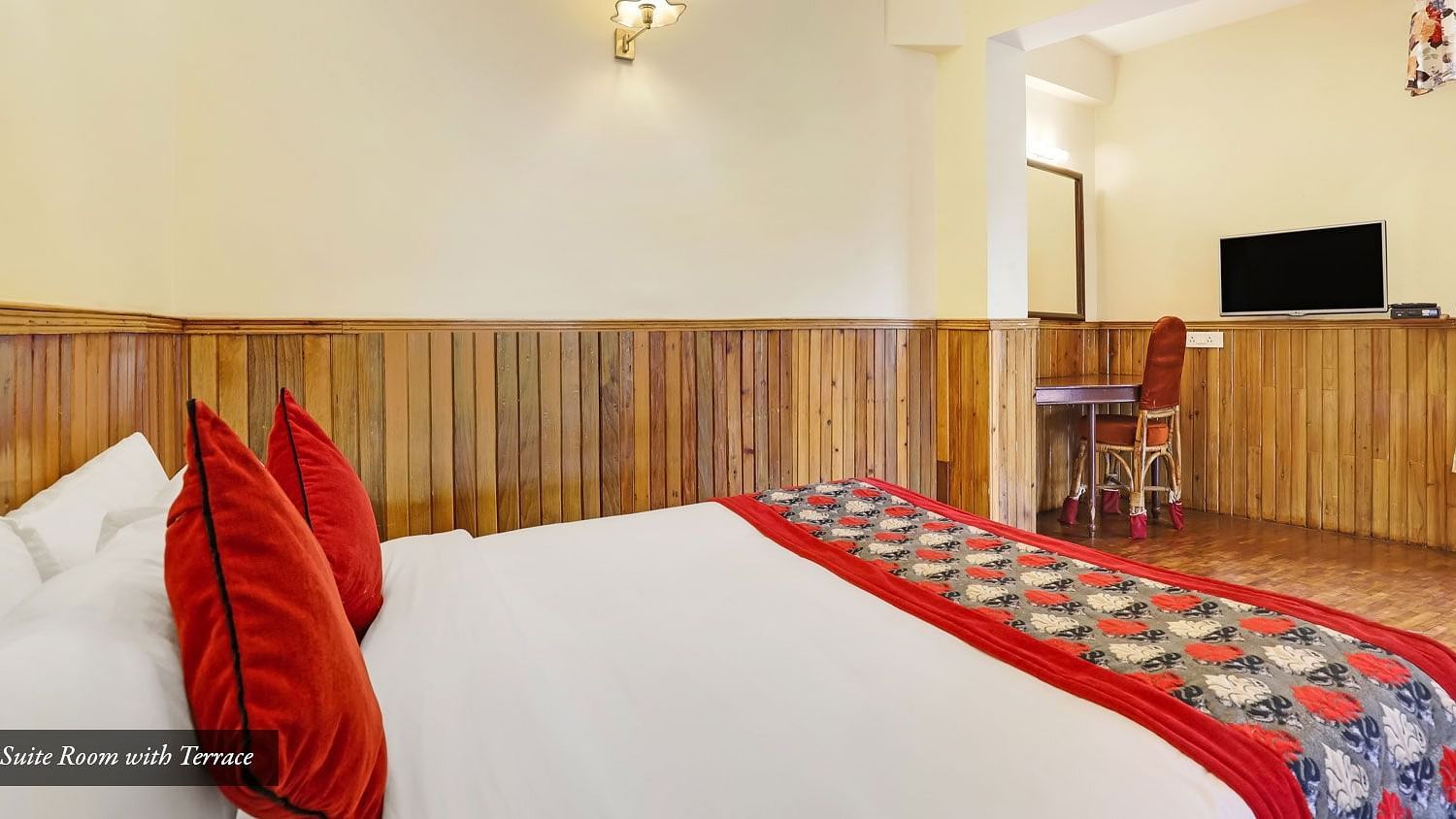 A side view of a bed in a room | Summit Newa Regency & Spa, Pelling