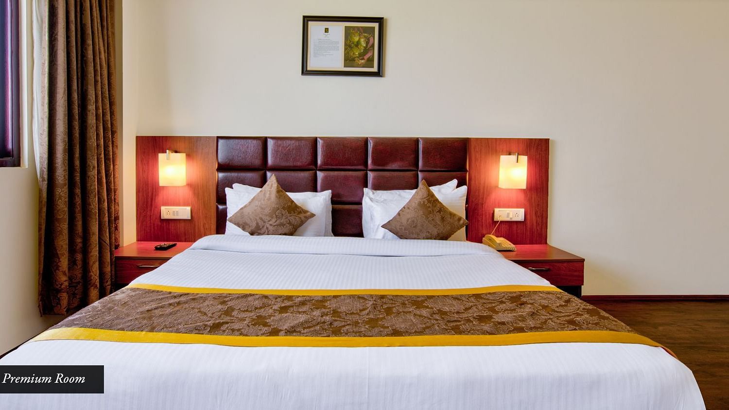 Premium Room with spacious bed, wooden headboard along with two bed side tables on each sideat Summit Ttakshang Residency Hotel & Spa, Gangtok4