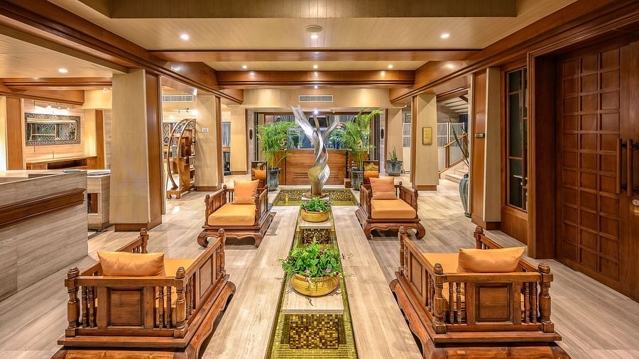 image of the lobby with traditional wooden seats for the guests - Maikhao Dream Villa Resort & Spa, Phuket