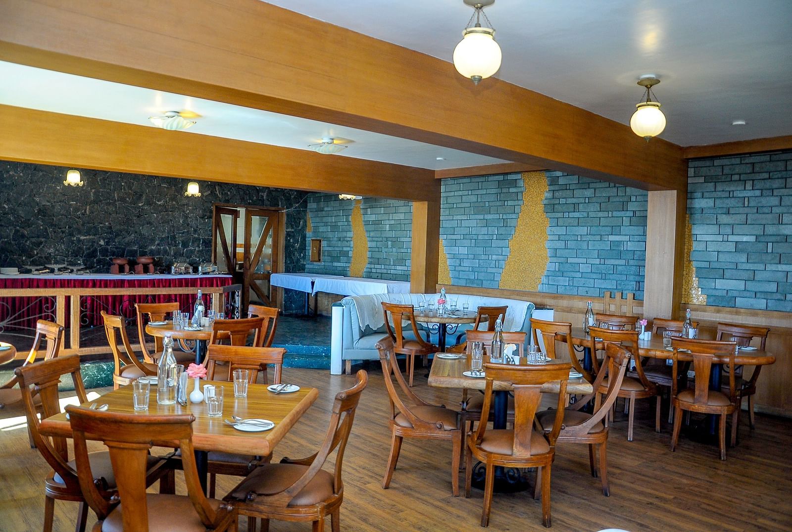 an elaborate seating arrangement at our multi-cuisine restaurant at La Montana By TGI, Ooty