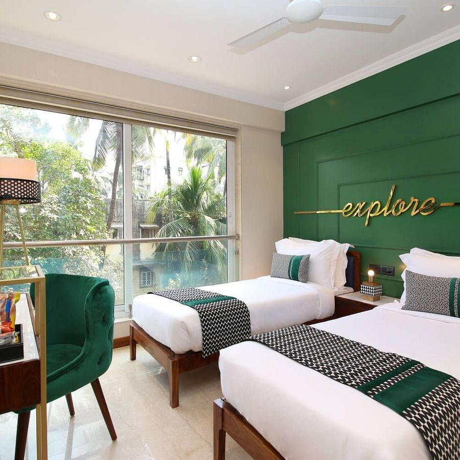 twin beds at the private 4 bedroom suite in bandra - theory9 service apartments